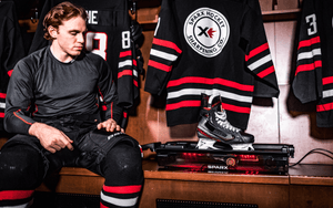 Image of hockey player sitting in locker room with Sparx Sharpener