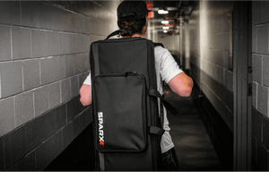 Image of man carrying the Sparx Sharpener travel bag