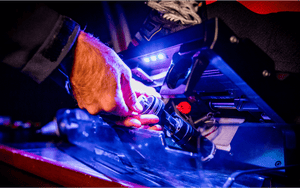 Image of a hand replacing a Sparx Grinding RIng